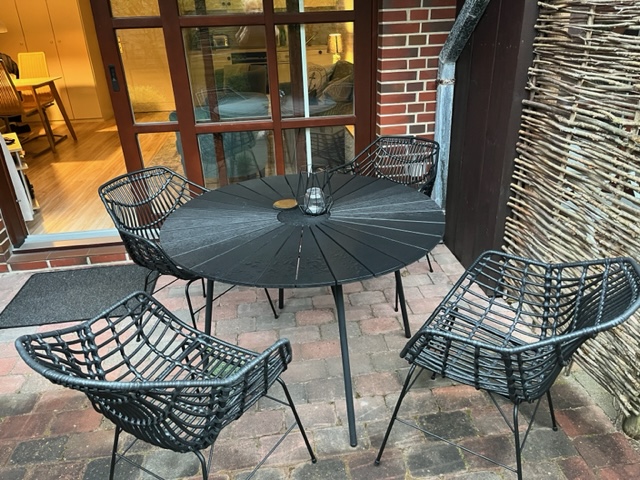 Vacation apartment C1 Hotel Sylter Hahn in Westerland terrace with chairs outside