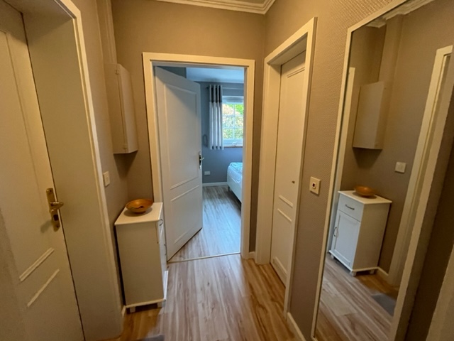 Vacation apartment C1 Hotel Sylter Hahn in Westerland hallway with mirror